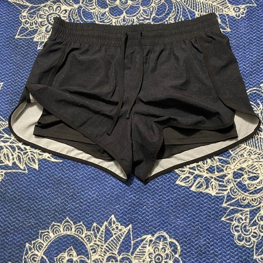 Athletic shorts with spandex under layer.